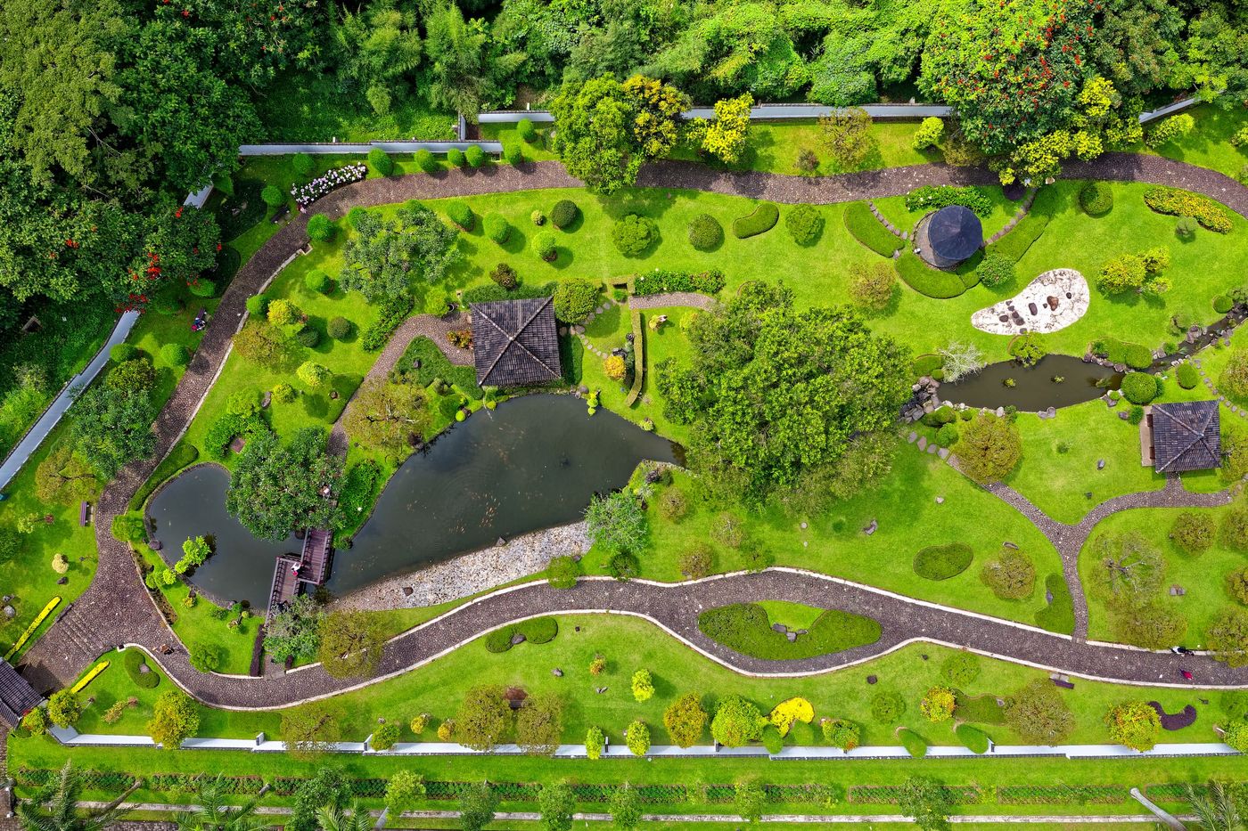 Urban park with trees, lawns and water features